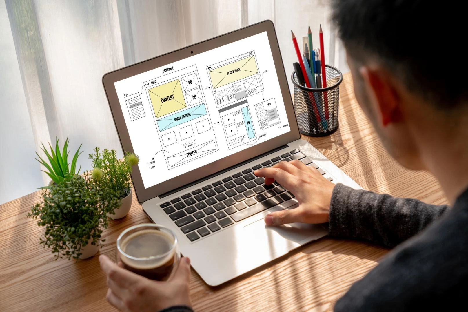 Website wireframes on a laptop